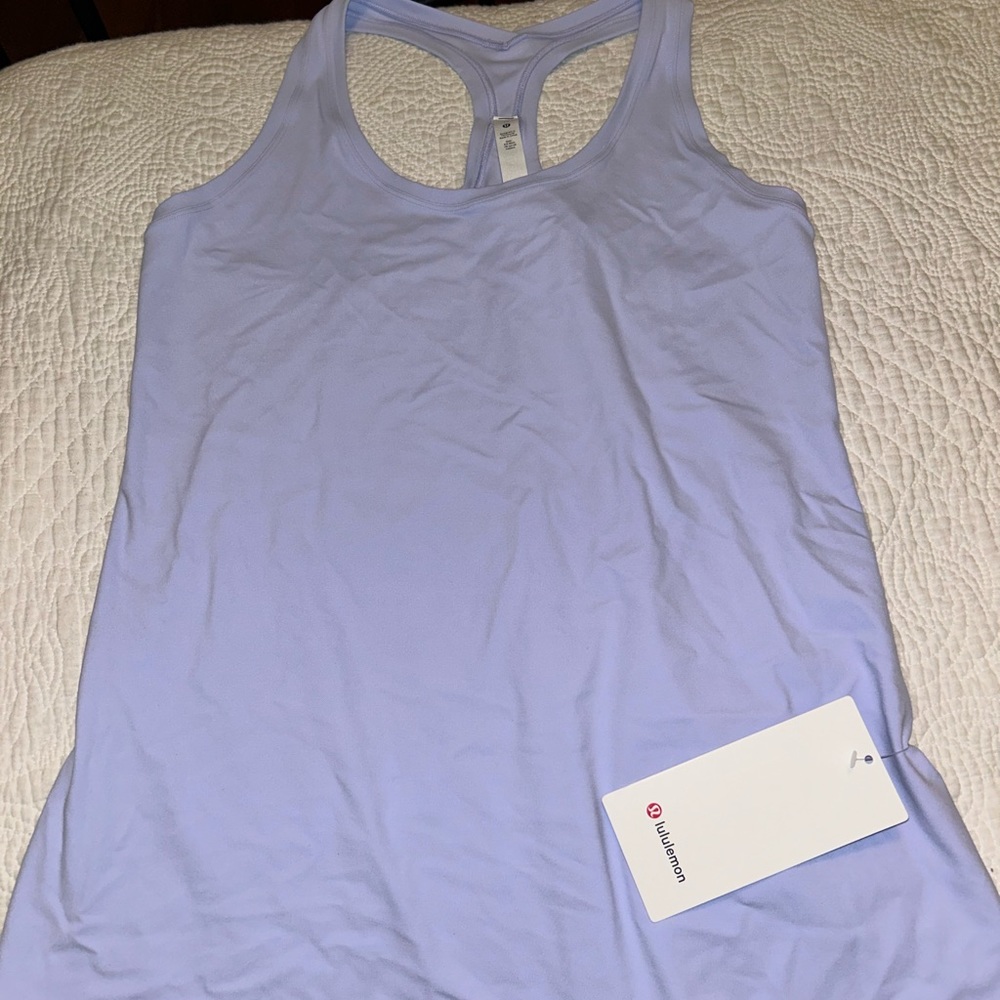 Lululemon Tank only worn once, Flawless condition. Tags not attached